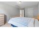 Bedroom with neutral color scheme and views of the property at 5909 Rue Chase Way, Tucker, GA 30084