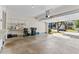 Spacious two car garage with an automatic door, featuring overhead lighting and built-in shelving at 5909 Rue Chase Way, Tucker, GA 30084