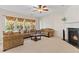 Inviting living room featuring a cozy fireplace, plush seating, and plenty of natural light at 5909 Rue Chase Way, Tucker, GA 30084