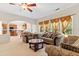Spacious living room filled with natural light and a comfortable furniture arrangement at 5909 Rue Chase Way, Tucker, GA 30084