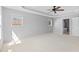 Expansive main bedroom featuring a trey ceiling and ceiling fan at 5909 Rue Chase Way, Tucker, GA 30084
