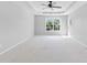 Spacious main bedroom with trey ceiling, ceiling fan and natural light at 5909 Rue Chase Way, Tucker, GA 30084