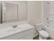 Bright bathroom features a sink, toilet, bathtub, and shower combination at 1159 Blue Juniper Cir, Loganville, GA 30052