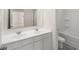 Bright bathroom featuring double sink vanity with white cabinets, toilet, and shower/tub combo at 1159 Blue Juniper Cir, Loganville, GA 30052