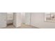 Bright bedroom features a walk-in closet, a window view, and an ensuite bathroom at 1159 Blue Juniper Cir, Loganville, GA 30052