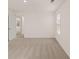 Carpeted bedroom with window, doorway, and view to the neighborhood at 1159 Blue Juniper Cir, Loganville, GA 30052