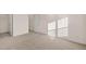 Spacious bedroom featuring neutral carpeting, two closets and an entry way at 1159 Blue Juniper Cir, Loganville, GA 30052