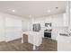 Modern kitchen features an island, stainless appliances, and white cabinets at 1159 Blue Juniper Cir, Loganville, GA 30052