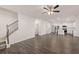 Open-concept living space connects the kitchen, living room, and staircase at 1159 Blue Juniper Cir, Loganville, GA 30052