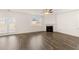 Bright living room with fireplace, ceiling fan, and sliding doors to the backyard at 1159 Blue Juniper Cir, Loganville, GA 30052