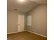 Bedroom with neutral paint, carpet, and window allowing for natural light at 233 Winterville Dr, Rockmart, GA 30153