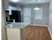 Cozy kitchen with granite counters, white cabinets, and stainless appliances at 233 Winterville Dr, Rockmart, GA 30153