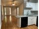 Eat-in kitchen features granite countertops, white cabinets and stainless steel dishwasher at 233 Winterville Dr, Rockmart, GA 30153