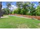 A scenic backyard with lush lawn, a privacy fence, and ample space for outdoor enjoyment at 3483 Addilyn Ne Ct, Marietta, GA 30066