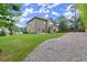 Inviting backyard featuring lush greenery, a patio, and privacy fence, creating a private outdoor space at 3483 Addilyn Ne Ct, Marietta, GA 30066