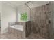 Luxurious bathroom with a separate shower and tub, featuring elegant tile and fixtures at 3483 Addilyn Ne Ct, Marietta, GA 30066