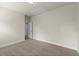 Carpeted bedroom with neutral walls and trim, features a door and a ceiling access panel at 3483 Addilyn Ne Ct, Marietta, GA 30066