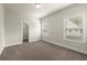 Bedroom features two windows, neutral walls, carpet, base trim and closet at 3483 Addilyn Ne Ct, Marietta, GA 30066