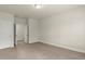 Neutral bedroom featuring carpet, a ceiling light, and white trim throughout at 3483 Addilyn Ne Ct, Marietta, GA 30066