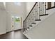 Bright entryway featuring hardwood floors, staircase with iron railings, and lots of natural light at 3483 Addilyn Ne Ct, Marietta, GA 30066