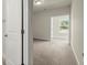 Neutral hallway with carpeted floors leading to a bedroom and bathroom at 3483 Addilyn Ne Ct, Marietta, GA 30066