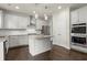 Modern kitchen featuring white cabinets, stainless steel appliances, and an island at 3483 Addilyn Ne Ct, Marietta, GA 30066