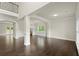 Bright living space featuring hardwood floors, wainscoting, white pillars, and lots of natural light at 3483 Addilyn Ne Ct, Marietta, GA 30066
