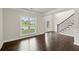 Bright living space featuring hardwood floors, wainscoting, white trim and lots of natural light at 3483 Addilyn Ne Ct, Marietta, GA 30066