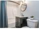 Updated bathroom features a shower-tub combo, vanity with sink, and modern fixtures at 391 Buchanan St, Dallas, GA 30157