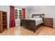 Bright bedroom with wood floors, large window, and ample space for a bed and furniture at 391 Buchanan St, Dallas, GA 30157