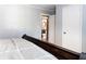 Bedroom featuring an ensuite bathroom view, hardwood floors, and neutral decor at 391 Buchanan St, Dallas, GA 30157