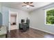 This bedroom features hardwood floors, neutral paint and a large window with tree views at 391 Buchanan St, Dallas, GA 30157