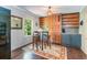 Charming breakfast nook with a round table, seating for four, built-in cabinets, and natural light at 391 Buchanan St, Dallas, GA 30157