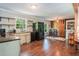 Bright, open kitchen with distressed cabinets, modern appliances, and a spacious dining area at 391 Buchanan St, Dallas, GA 30157