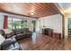 Cozy living room with hardwood floors, a comfortable sofa, and a view of the outdoors at 391 Buchanan St, Dallas, GA 30157