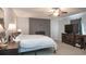 Cozy main bedroom features a decorative fireplace, ceiling fan, and neutral paint at 391 Buchanan St, Dallas, GA 30157