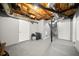 Unfinished basement featuring concrete flooring and exposed ceiling, offering potential for customization at 14301 Veterans Memorial Highway, Villa Rica, GA 30180