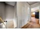 This hallway is between a kitchen and a stairway; hardwood floors at 14301 Veterans Memorial Highway, Villa Rica, GA 30180