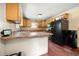 Bright kitchen includes plentiful counter space, wooden cabinets and modern appliances at 14301 Veterans Memorial Highway, Villa Rica, GA 30180