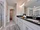 Modern bathroom boasting a double vanity with black countertops and a glass-enclosed shower at 1824 Emory Ln # 88, Conyers, GA 30013