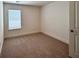 Bedroom with neutral carpet, a window, and a door at 1824 Emory Ln # 88, Conyers, GA 30013