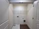 Walk-in closet offering ample storage space with shelving and connections for a washer and dryer at 1824 Emory Ln # 88, Conyers, GA 30013