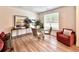 Bright dining room with a glass table, contemporary chairs, and views of the landscaped yard at 1824 Emory Ln # 88, Conyers, GA 30013