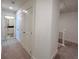 Hallway with closet and bathroom featuring neutral color palette and carpet flooring at 1824 Emory Ln # 88, Conyers, GA 30013