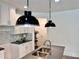 Close-up of the kitchen island featuring a stainless steel sink, modern faucet, and stylish lighting at 1824 Emory Ln # 88, Conyers, GA 30013