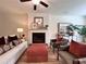 Inviting living room featuring a fireplace and comfortable seating with an ottoman at 1824 Emory Ln # 88, Conyers, GA 30013