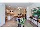 Open-concept living room with modern furnishings, a fireplace, and seamless flow into the kitchen at 1824 Emory Ln # 88, Conyers, GA 30013