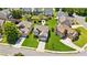 An aerial shot of a well-maintained property featuring green lawns and mature landscaping in a suburban neighborhood at 2185 Creole Cir, Cumming, GA 30040