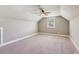Large bonus room with vaulted ceilings, carpet, and abundant natural light at 2185 Creole Cir, Cumming, GA 30040