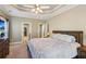 Serene bedroom with soft lighting, cozy bed, and access to a walk-in closet at 2185 Creole Cir, Cumming, GA 30040